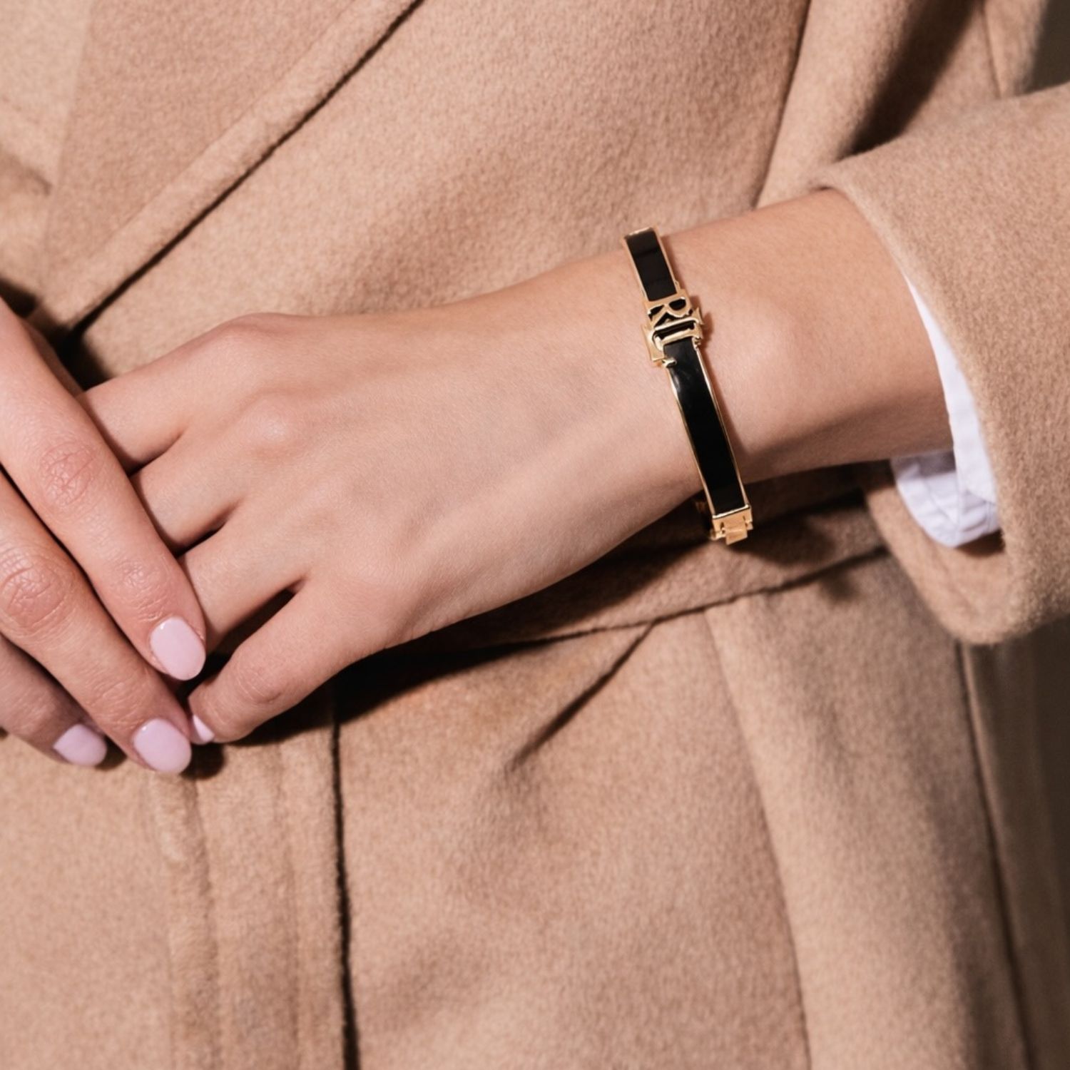Lauren Ralph Lauren Gold Tone Black Enamel Logo Bangle | Ernest Jones